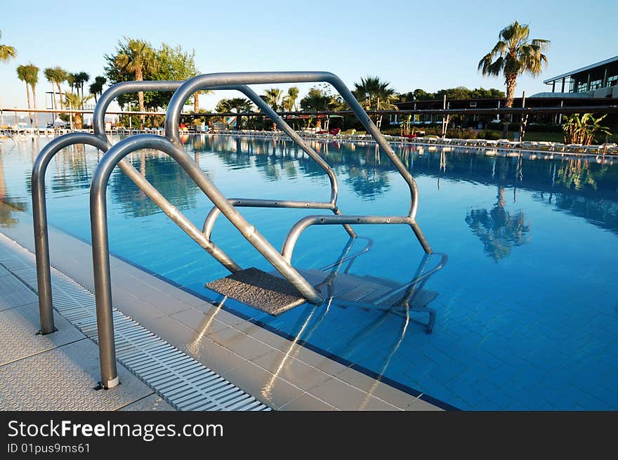 Steel hand-rails of a pool. Steel hand-rails of a pool