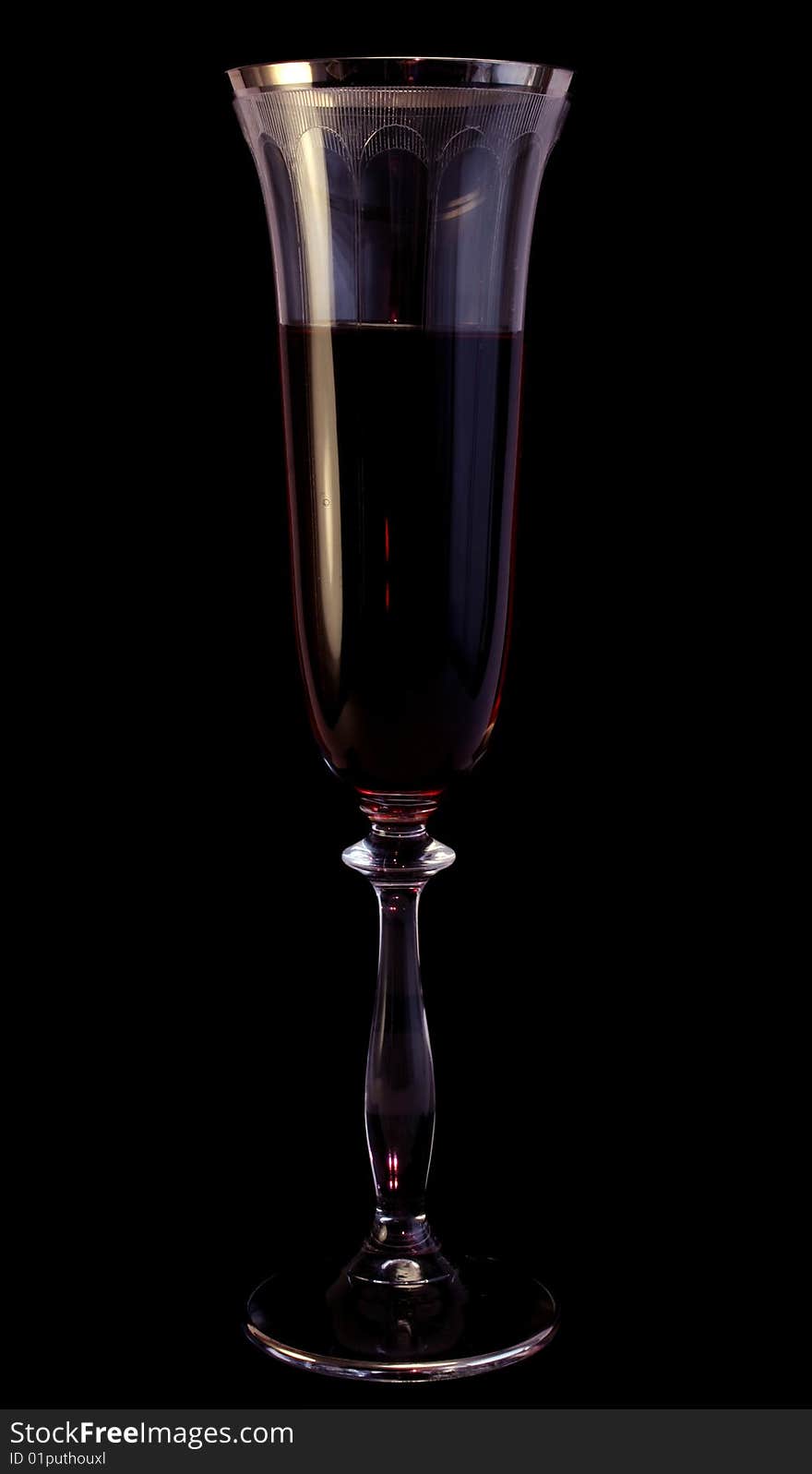 Glass with wine on a black background, dark