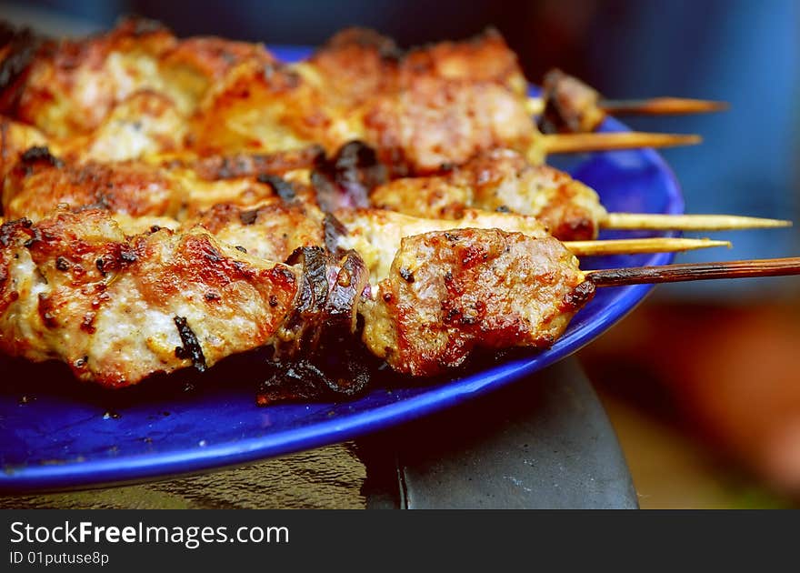 Pork kebab with onion on the BBQ