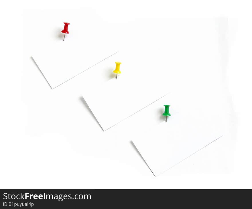 Notes with colored thumbtacks, isolated over white