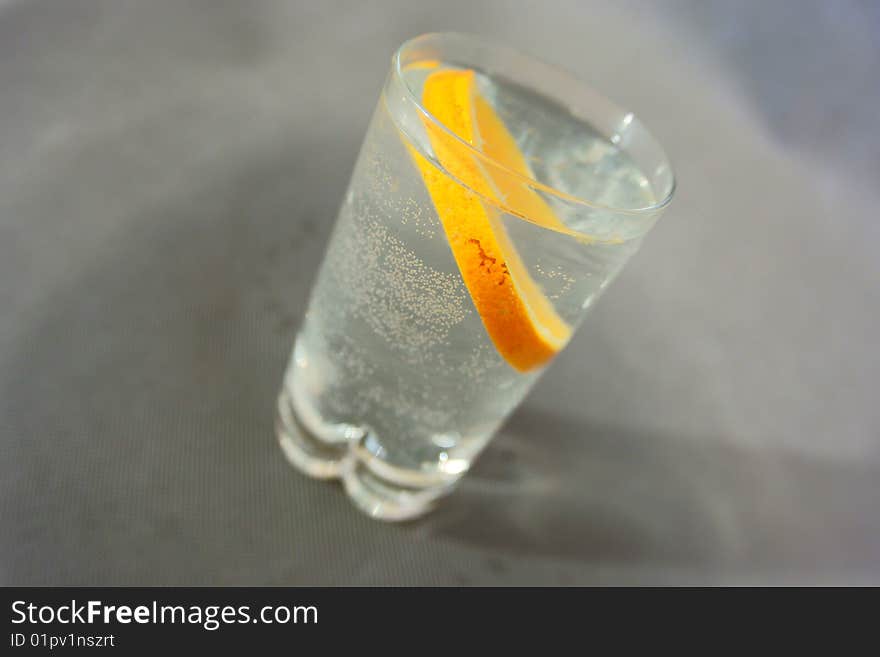 Orange fruit in glass on water