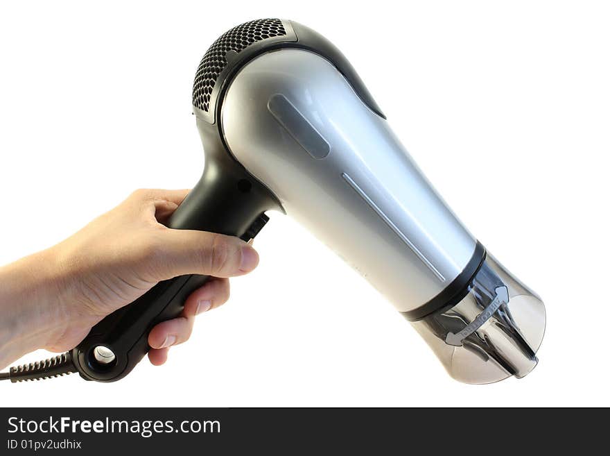 The hair dryer in a hand on a white background, is isolated