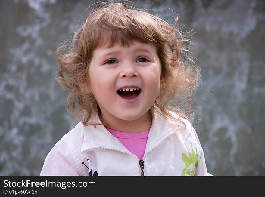 Beautiful girl near the fountain