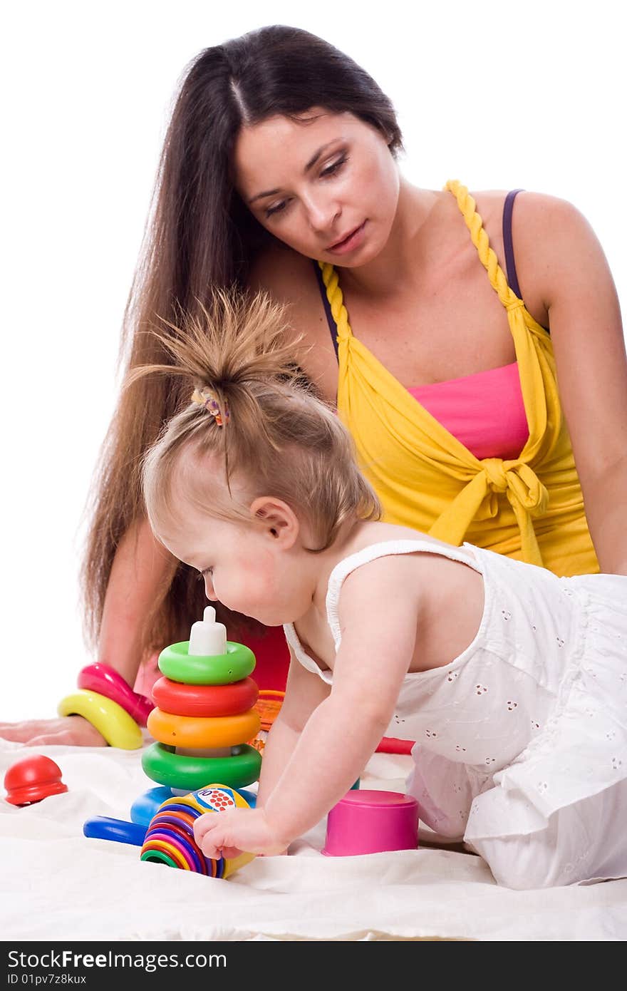 Little girl with beautiful mother isolated at white background