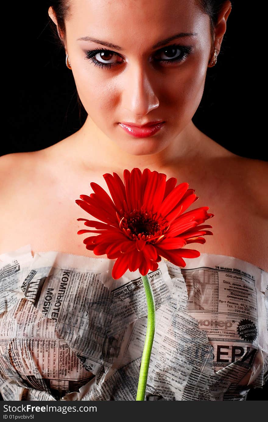 Beautiful woman, newspaper and flower