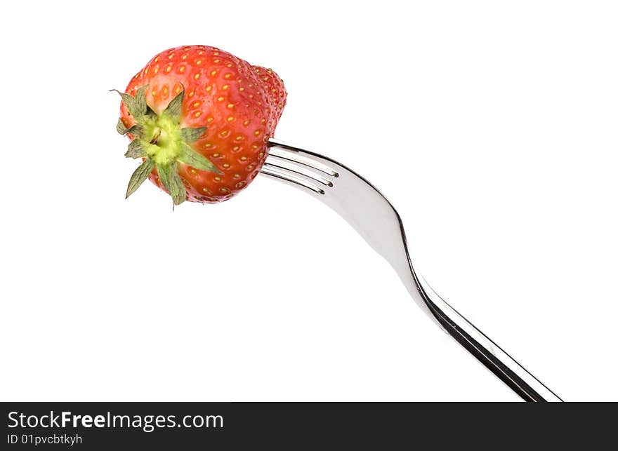 Strawberry close-up on a fork