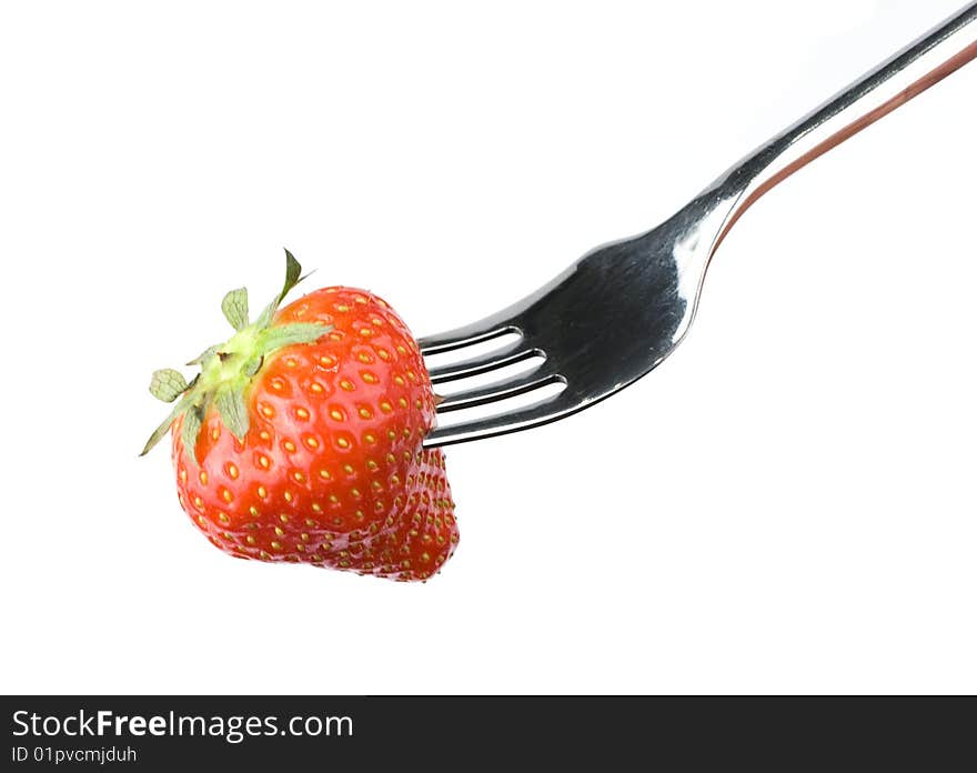 Strawberry close-up on a fork