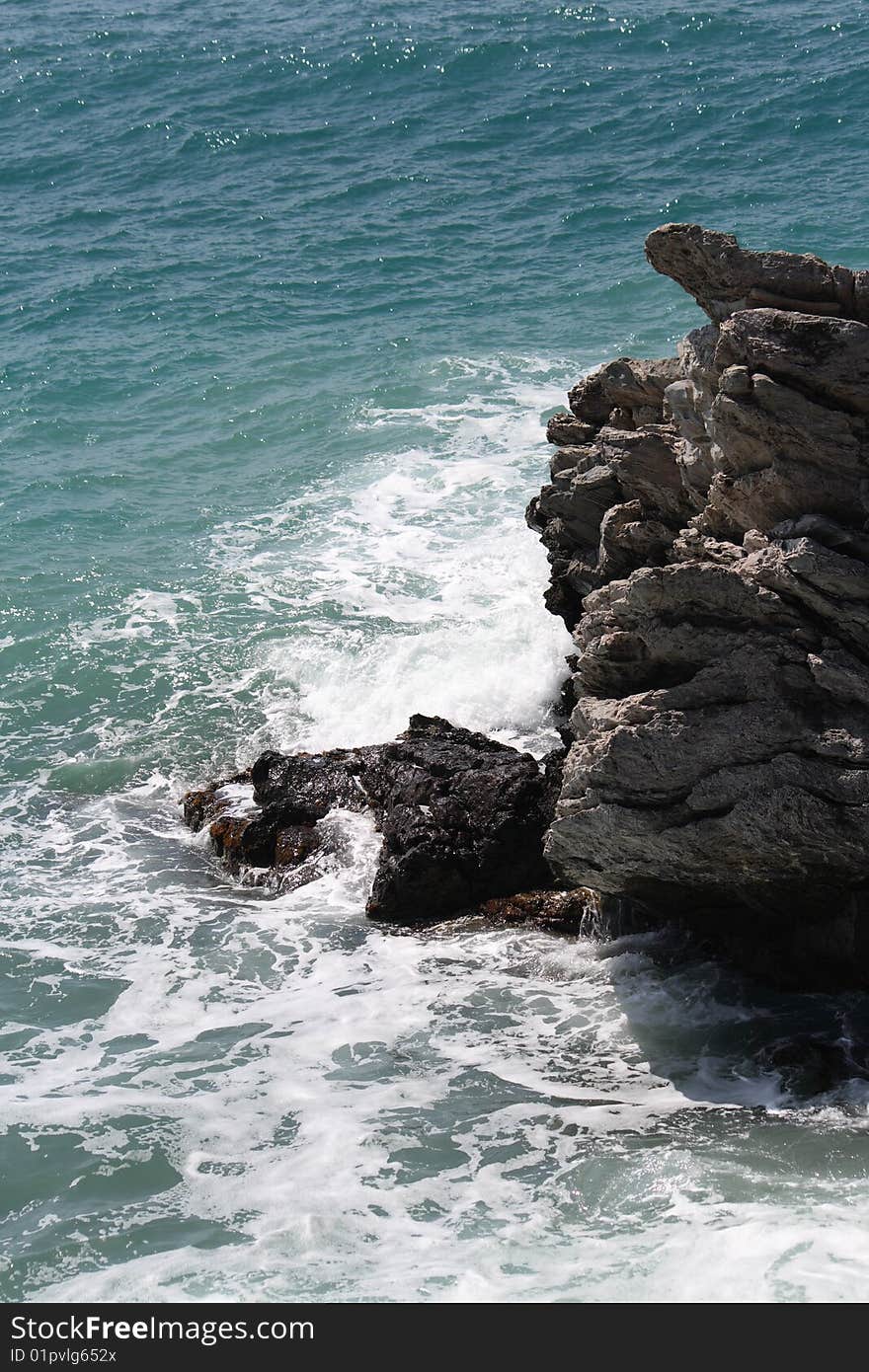 Mediterrean sea while hits rocks. Mediterrean sea while hits rocks