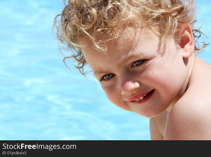 A child coming out of the water on a hot summer's day. A child coming out of the water on a hot summer's day