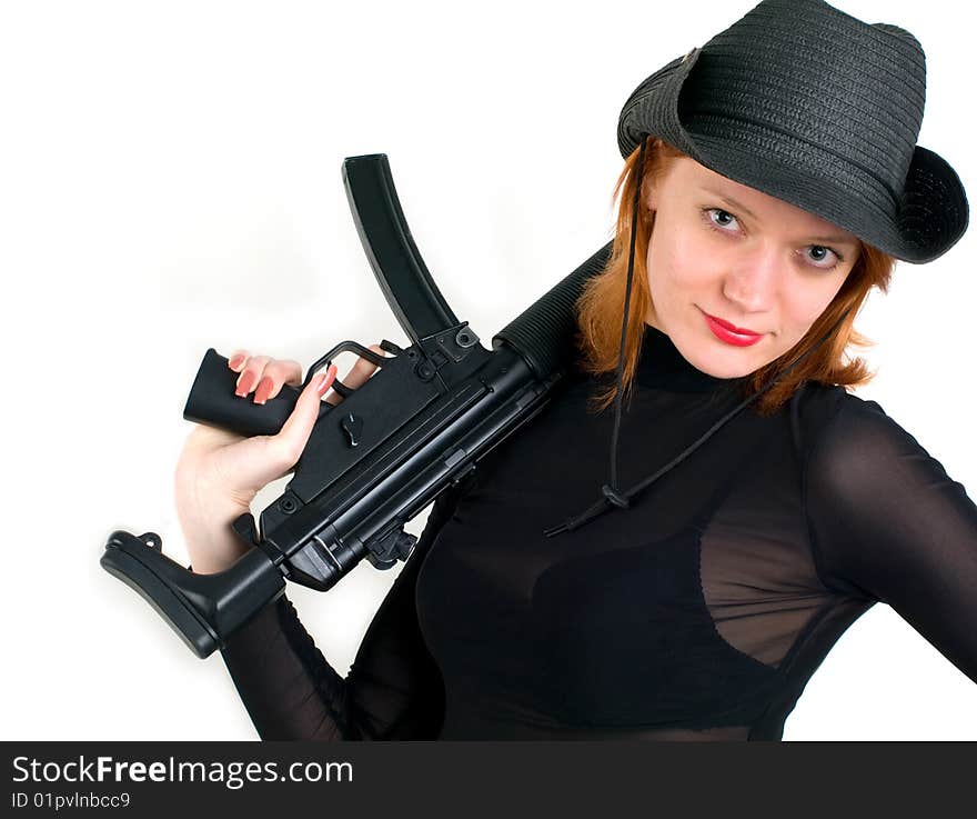 Sexy red young woman in a cowboy hat holding the gun