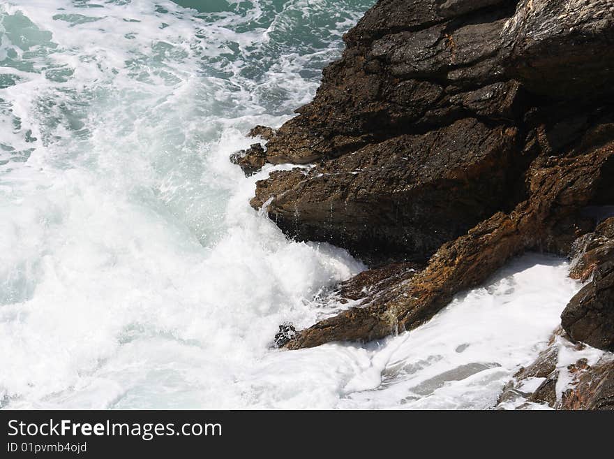 Mediterrean sea while hits rocks. Mediterrean sea while hits rocks