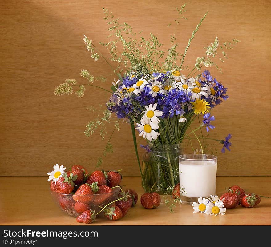 Strawberries and milk with flowers