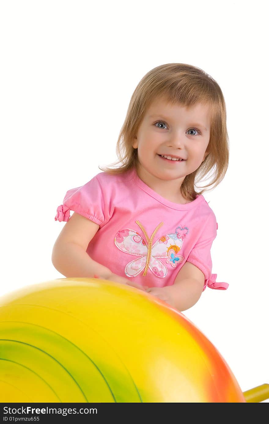 Little girl and big yellow ball on white background