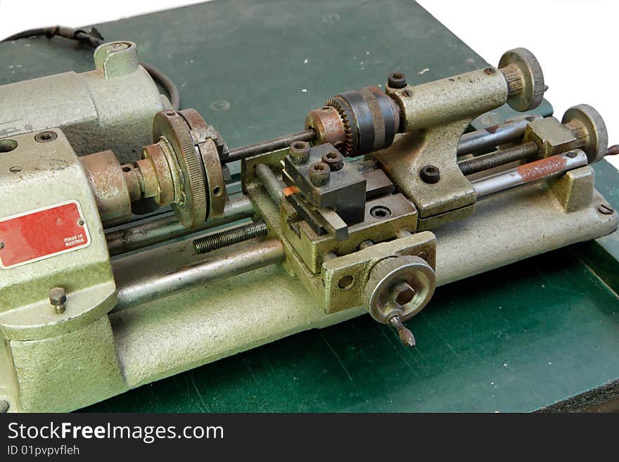 Small portable lathe isolated closeup