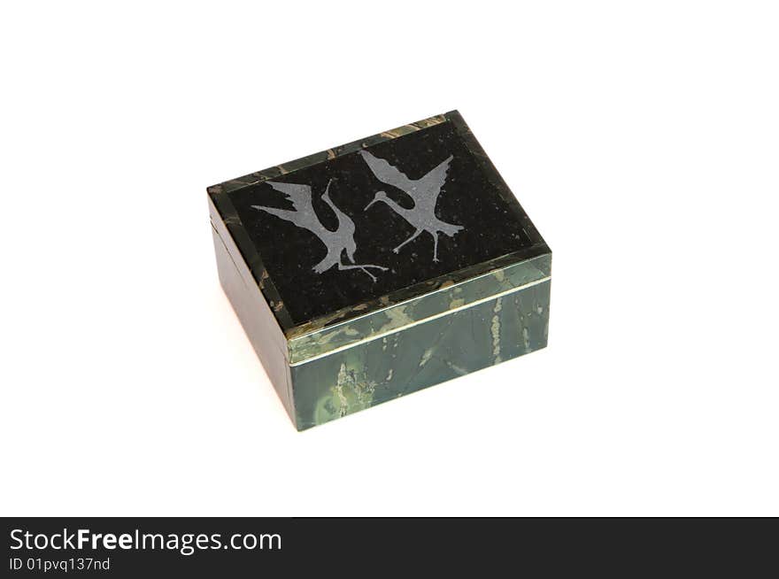 Jasper stone casket engraved with dancing cranes isolated. Jasper stone casket engraved with dancing cranes isolated