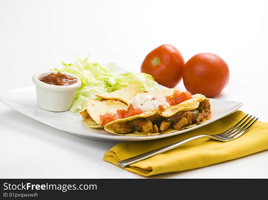 Delicious chicken quesadilla and fresh vegetables isolated