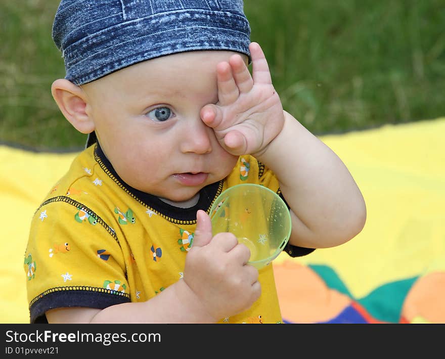 The little boy in a bright sunny day. The little boy in a bright sunny day