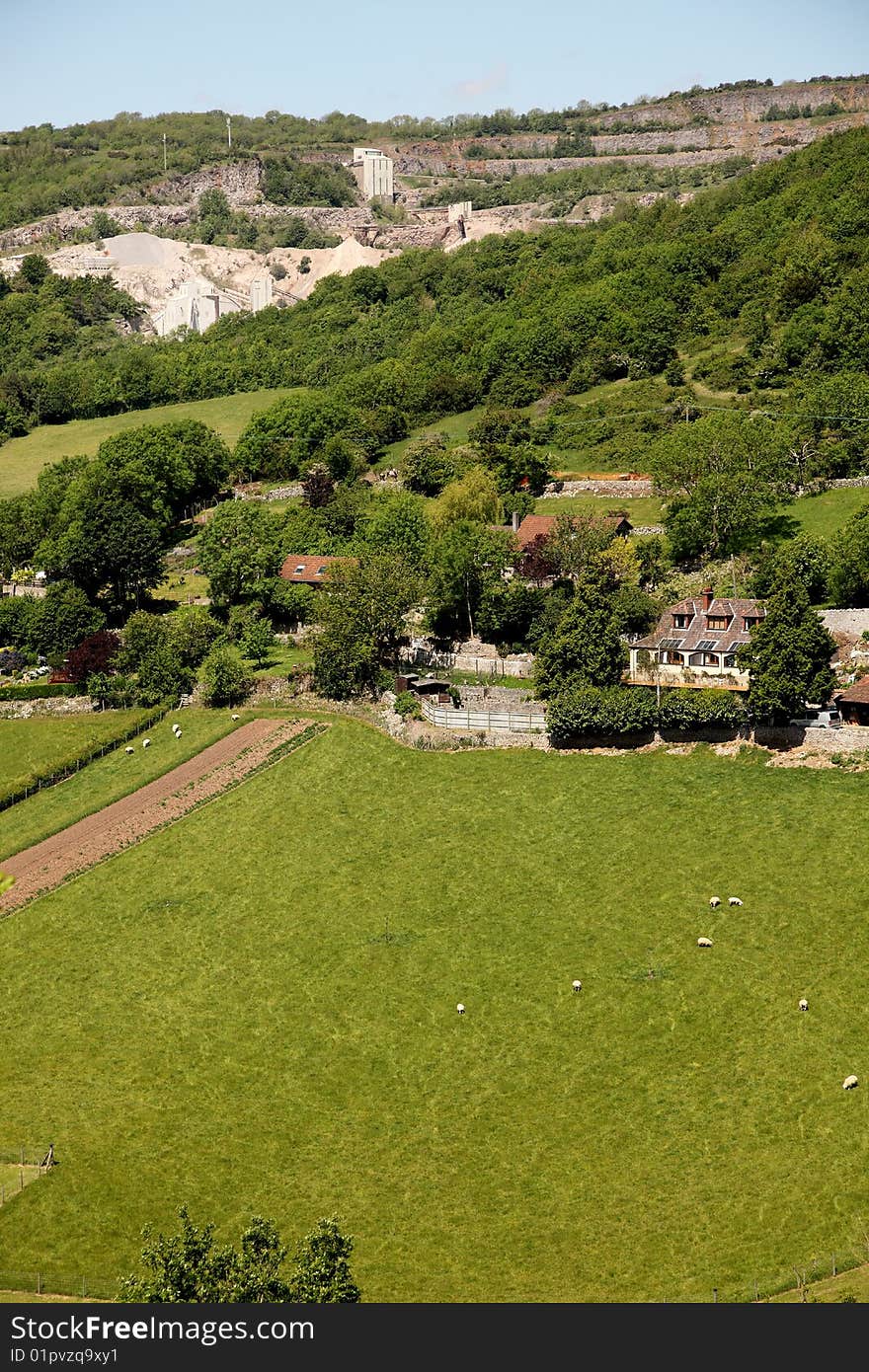 Limestone quarry in the hills behind the village of Cheddar. Limestone quarry in the hills behind the village of Cheddar.