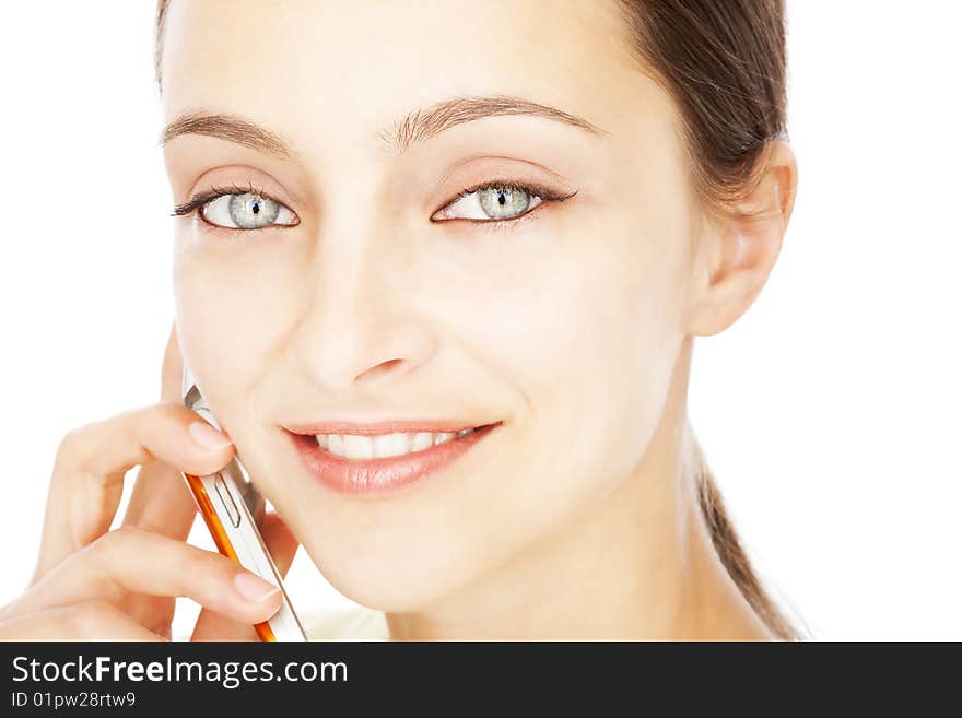 Closeup portrait of a young lady using cellphone isolated on white background