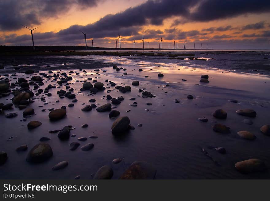 Accompanied by a beautiful golden sunset windmill down. Accompanied by a beautiful golden sunset windmill down