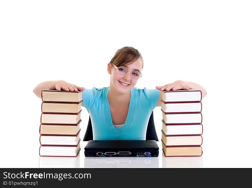 Happy smiling teenager girl on desk doing studying and homework