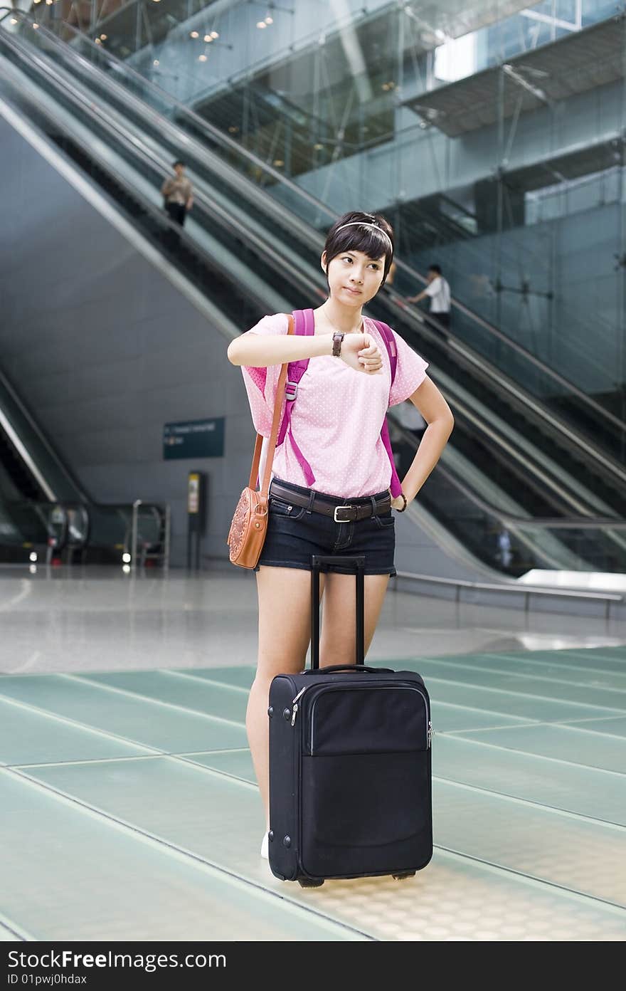 An asian girl at singapore's changi airport terminal