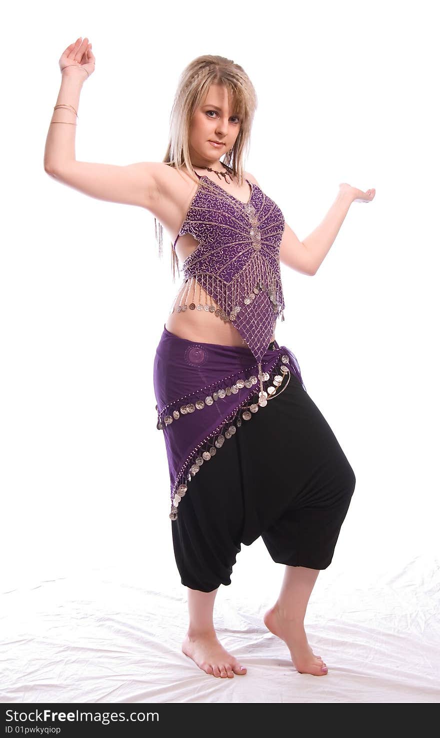 Indian dance. Young woman on white background.