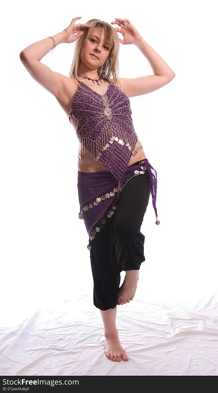 Indian dance. Young woman on white background.