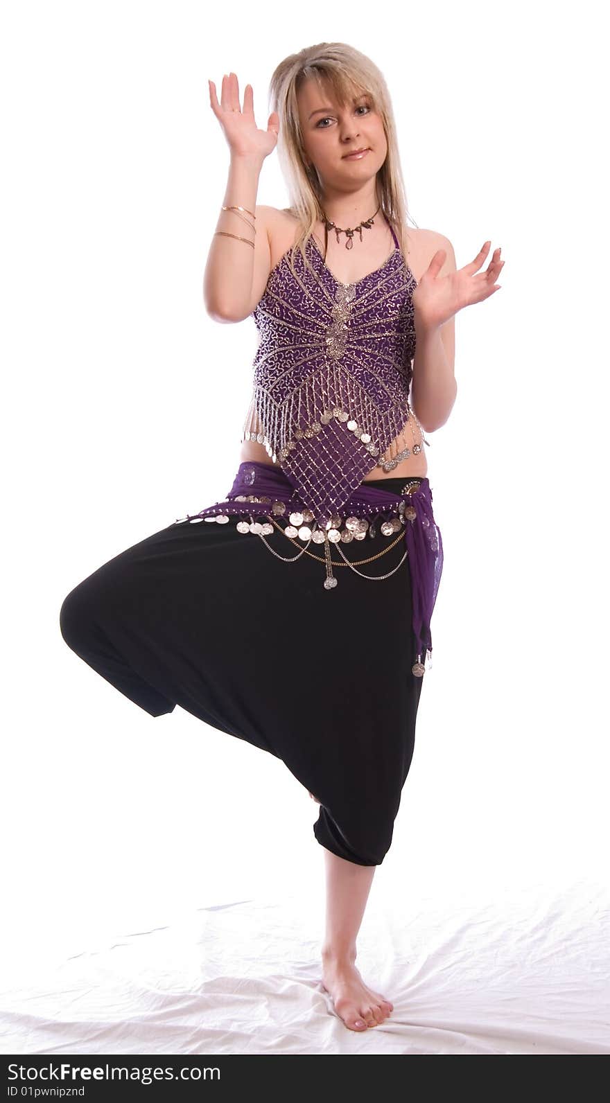 Indian dance. Young woman on white background.