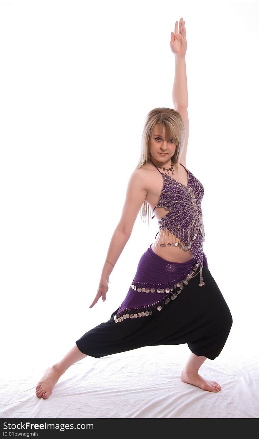 Indian dance. Young woman on white background.