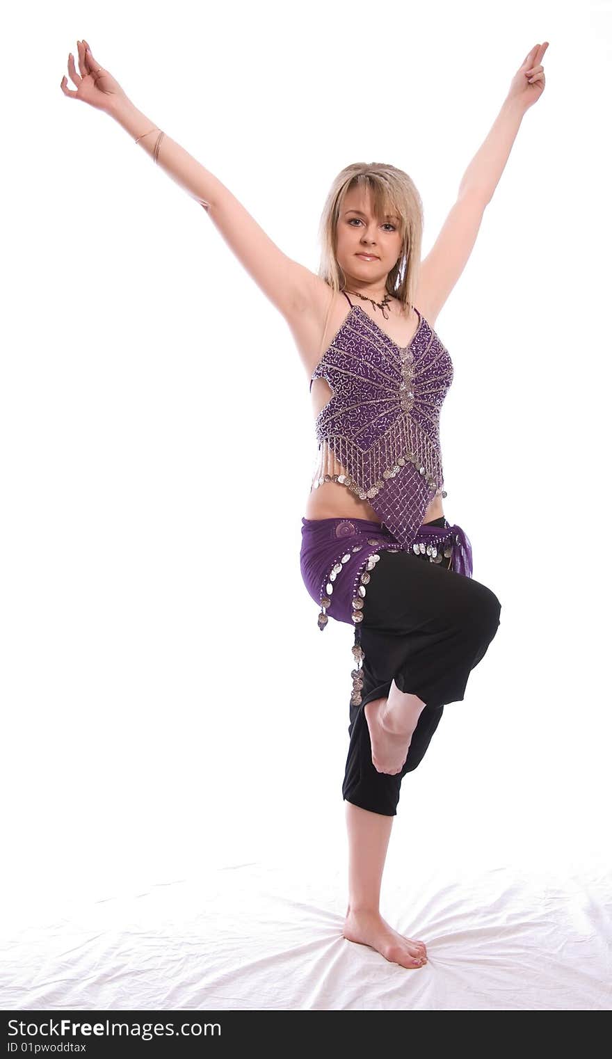 Indian dance. Young woman on white background.