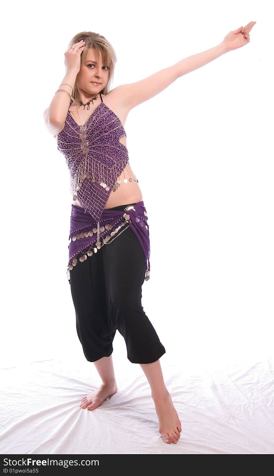 Indian dance. Young woman on white background.