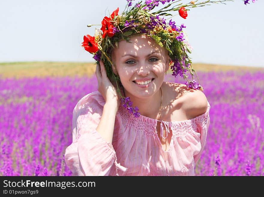 Happy Girl In Floral Wreath On Natural Background