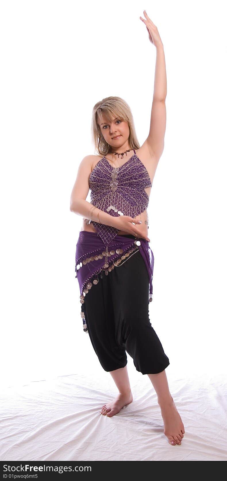 Indian dance. Young woman on white background.