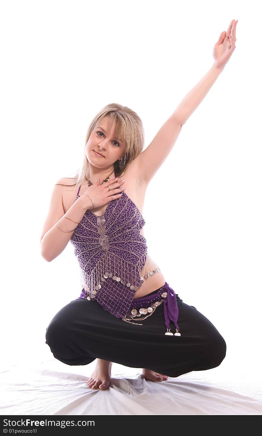 Indian dance. Young woman on white background.