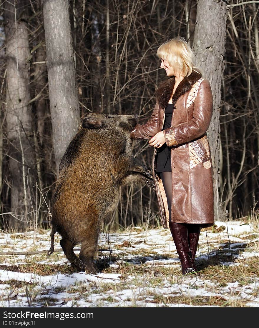 Blonde girl with wild boar