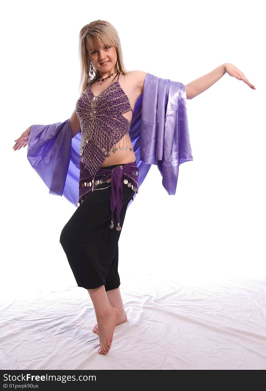 Indian dance. Young woman on white background.