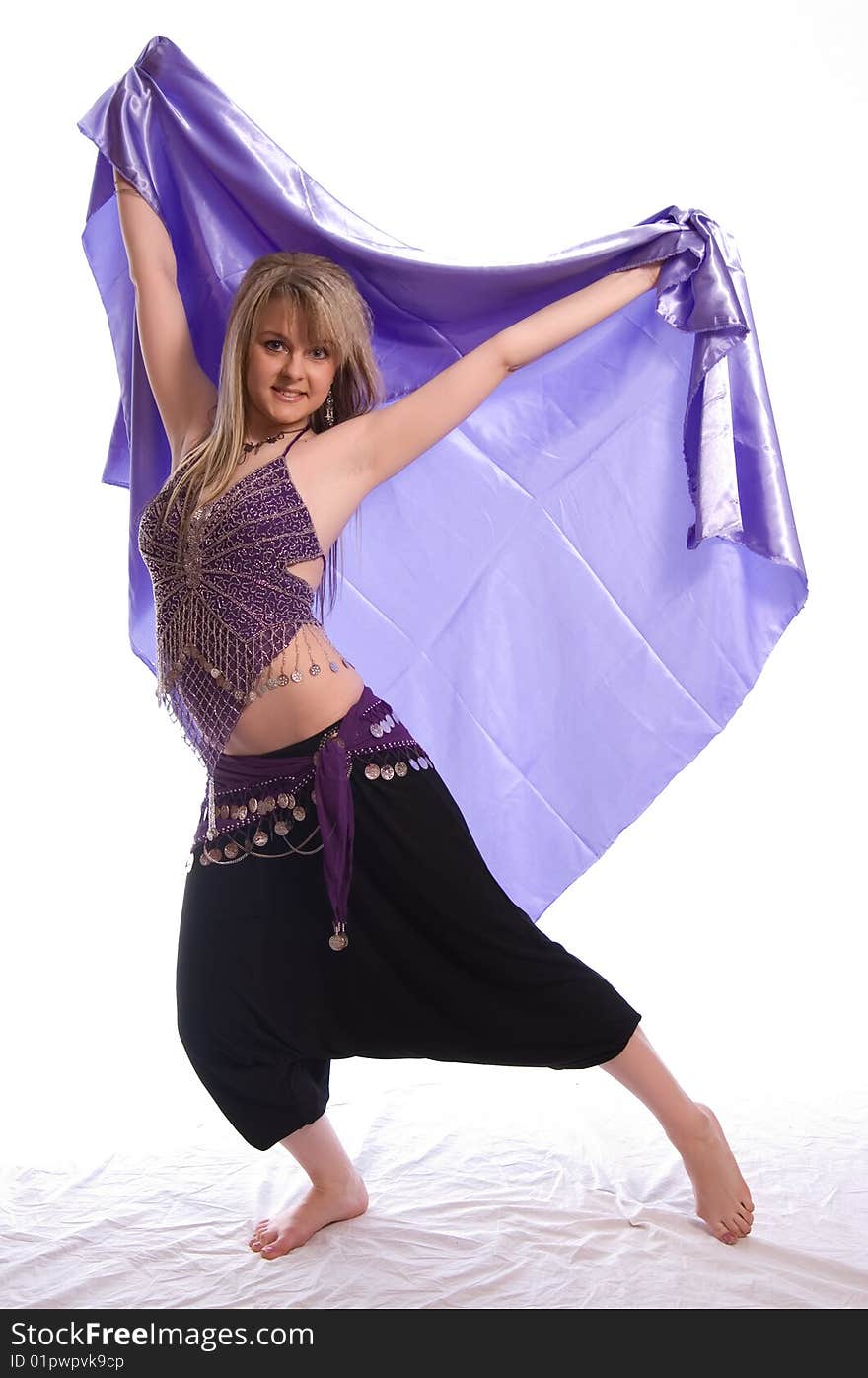 Indian dance. Young woman on white background.