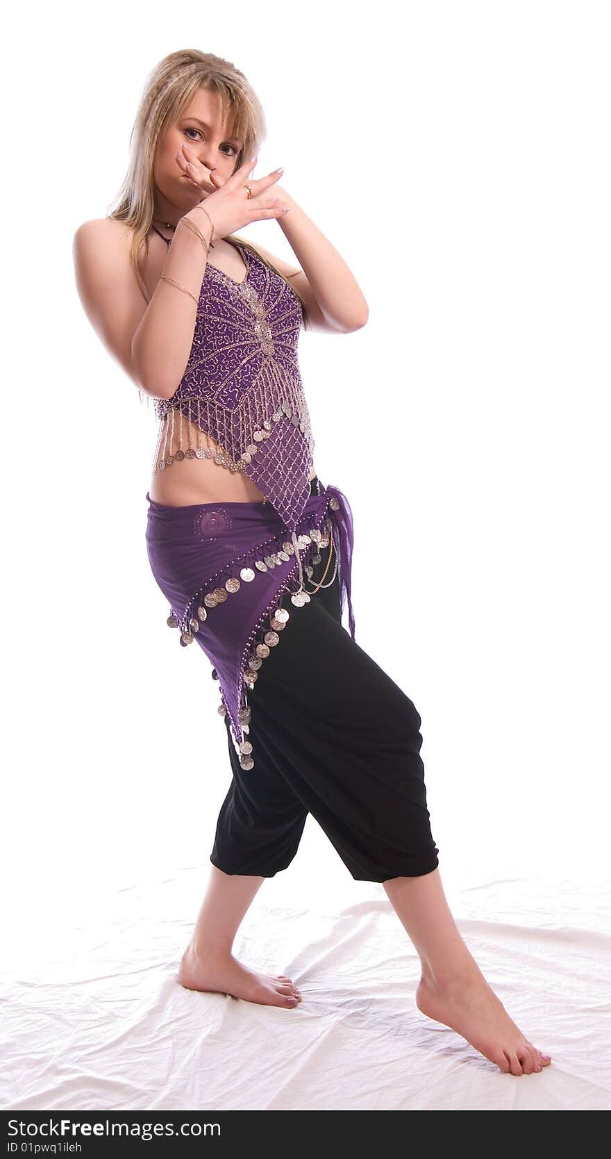 Indian dance. Young woman on white background.