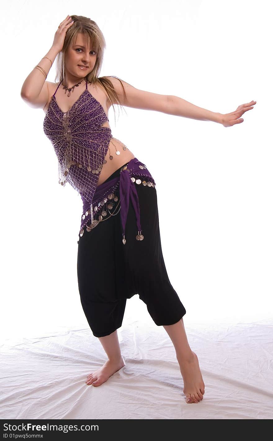 Indian dance. Young woman on white background.