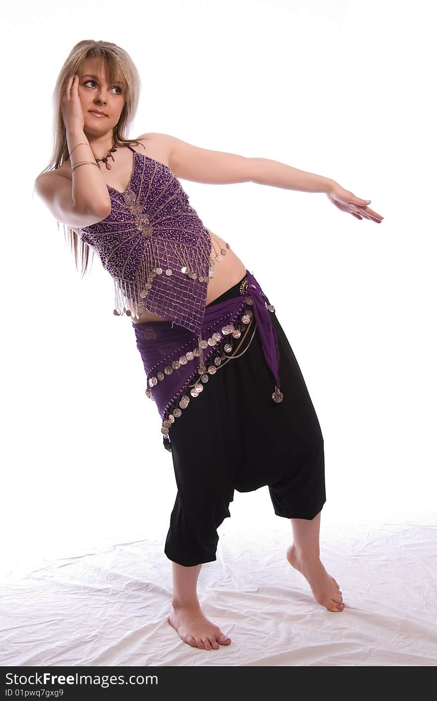 Indian dance. Young woman on white background.