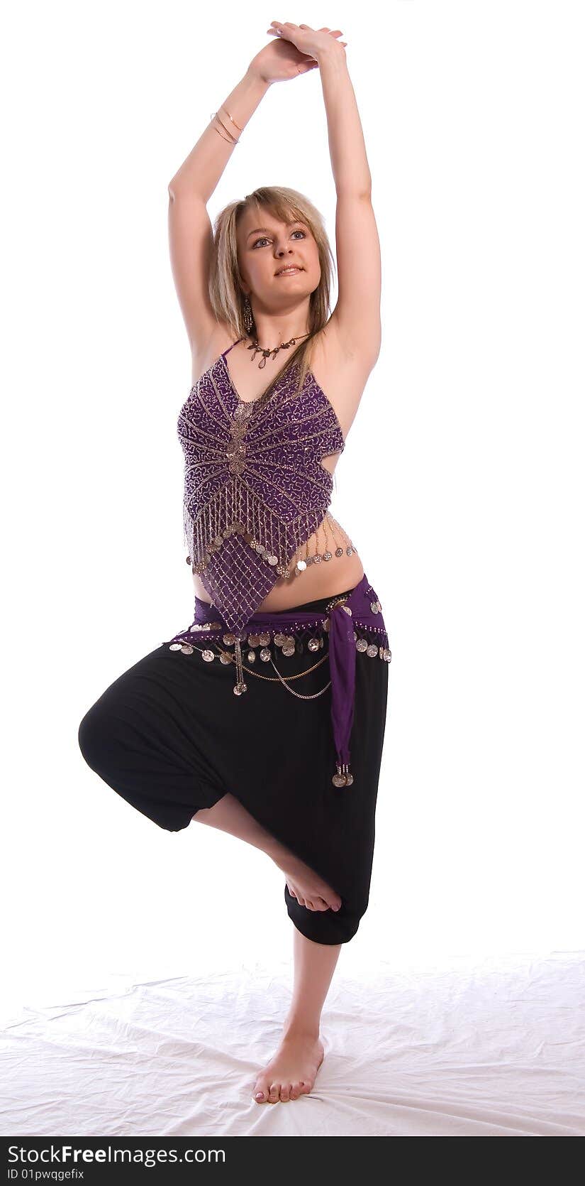 Indian dance. Young woman on white background.