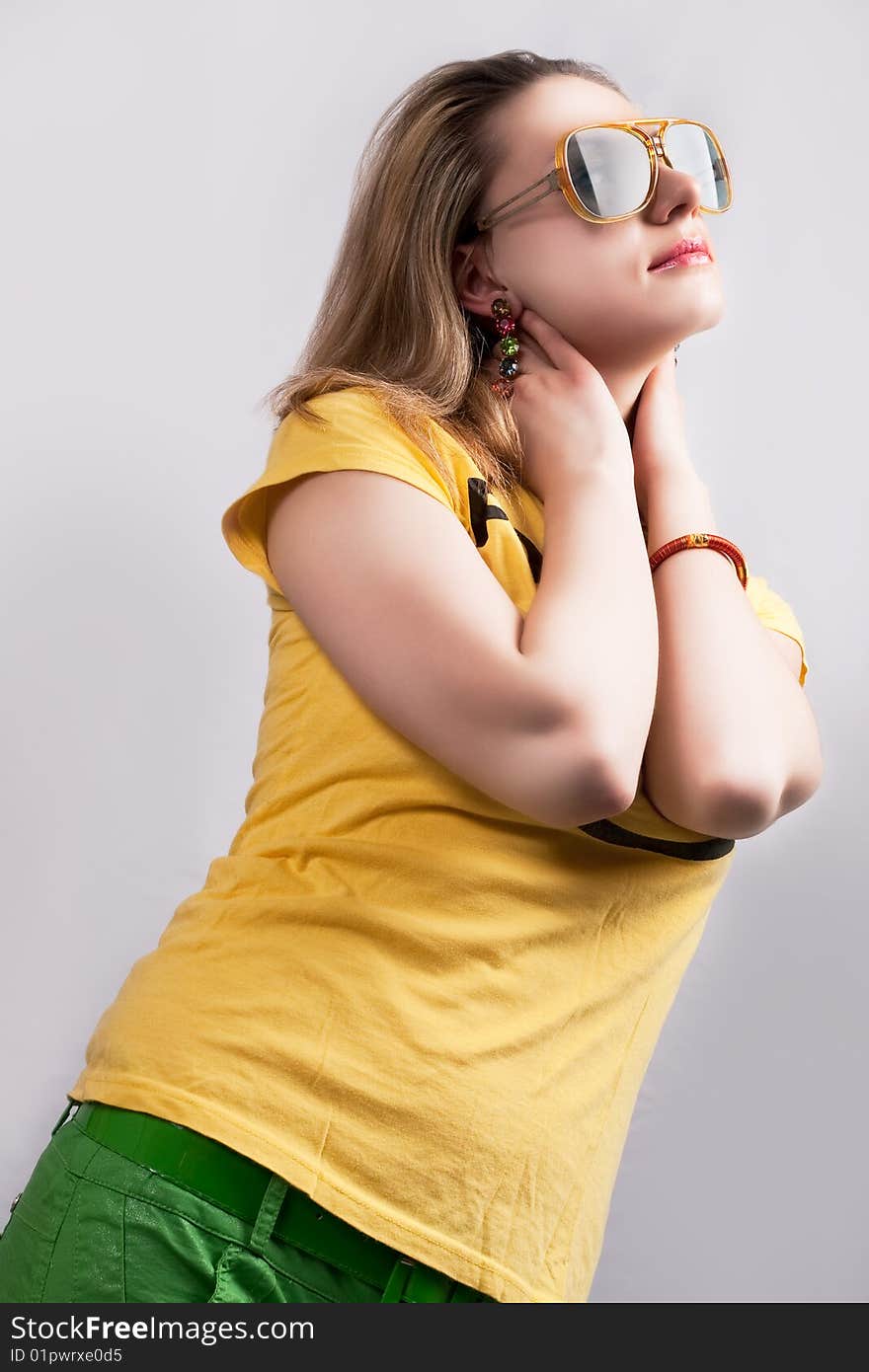 Blonde with hands lifted and crossed looking up separated