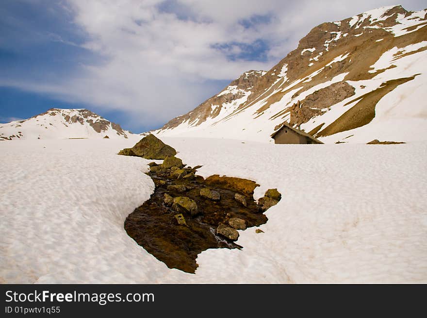 The photo of snowy slopes in the high Alps (Above 2000 m). The photo of snowy slopes in the high Alps (Above 2000 m).