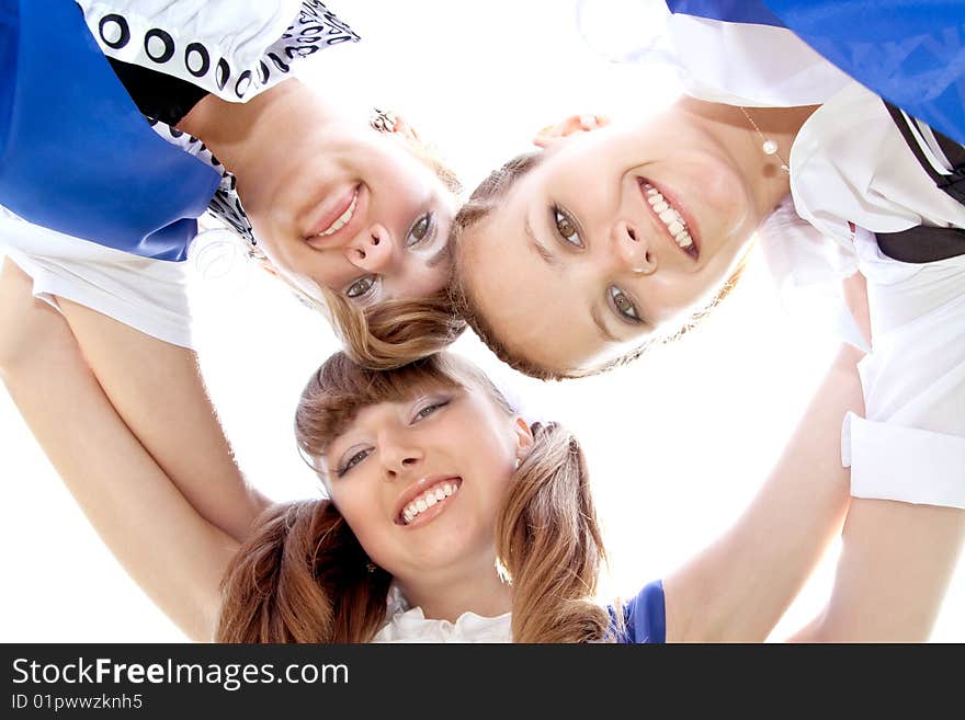 Three funny graduates posing outdoors