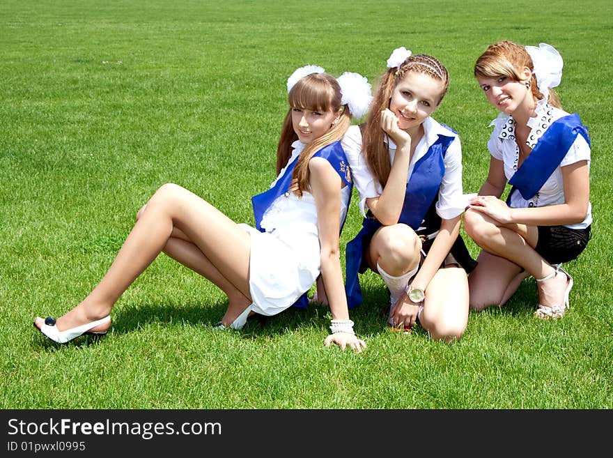 Three funny graduates posing outdoors