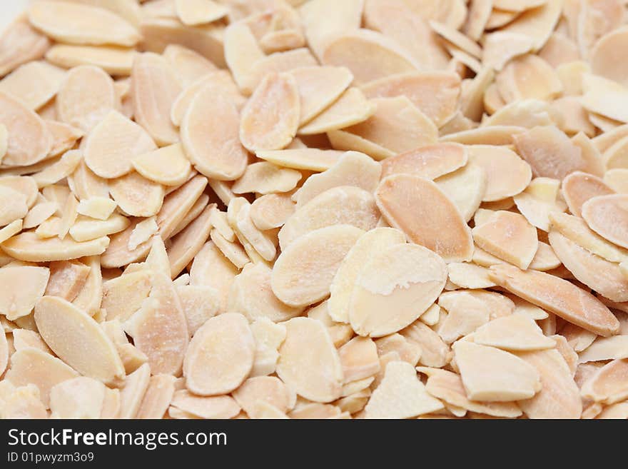 A macro shot of shaved almonds.