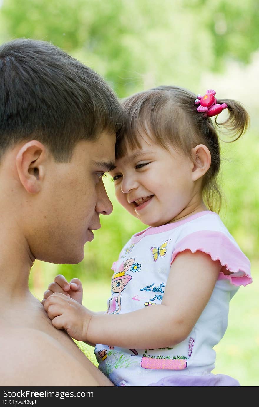 Happy father and daughter outdoor fun in Summer