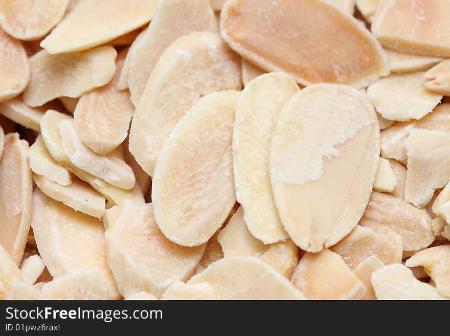 A macro shot of shaved almonds.