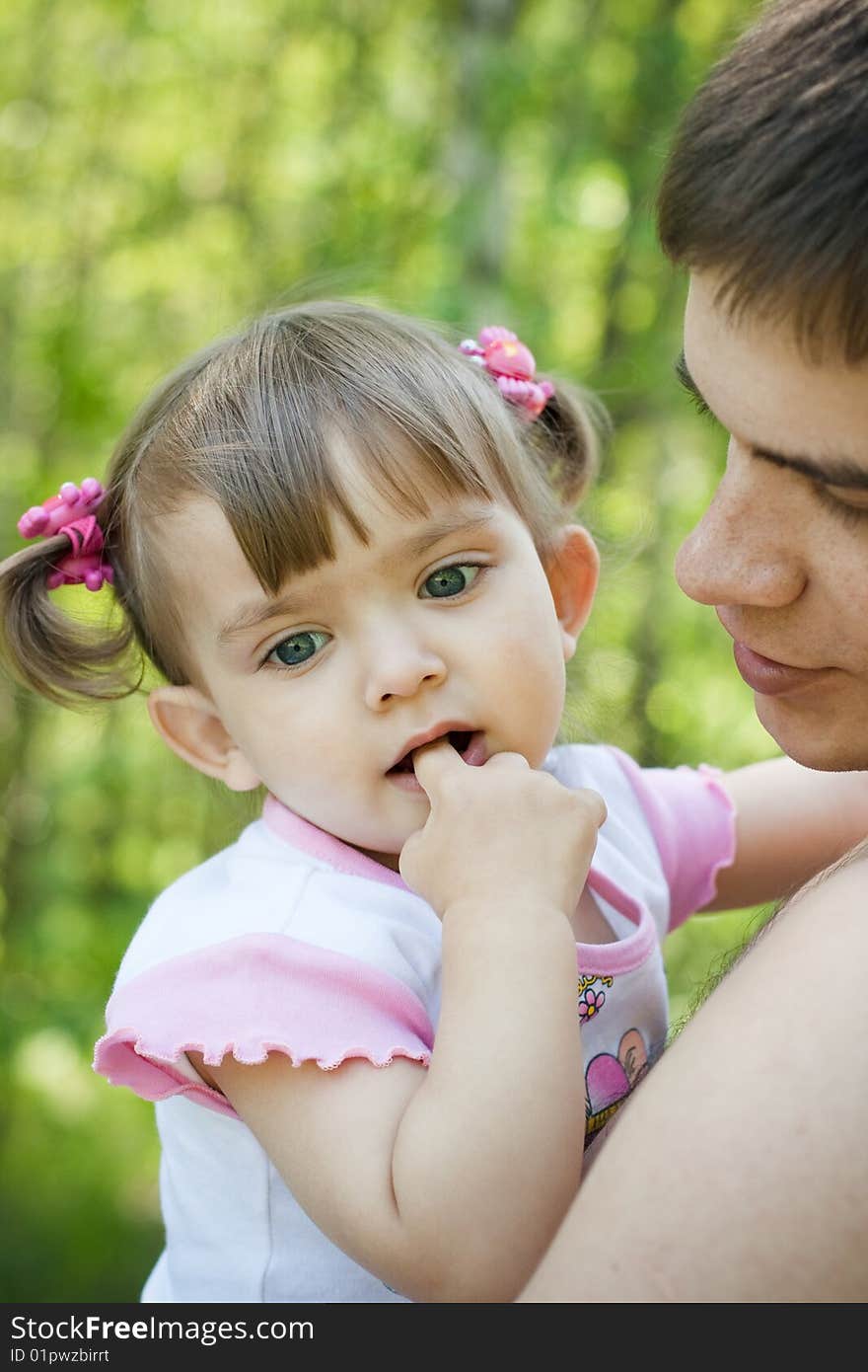 Happy father and little daughter outdoor in summer